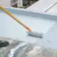 Roof Coating With Silicone On A Commercial Roof