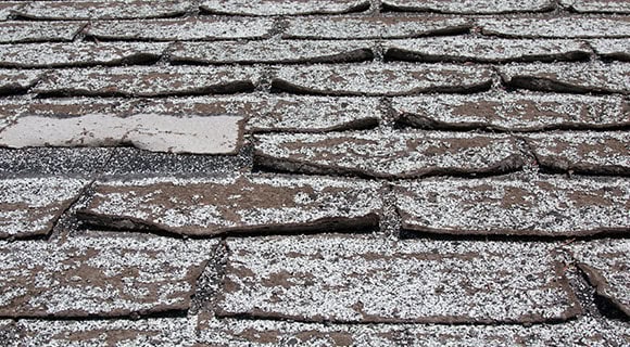 Commercial apartment building aging asphalt shingle roofing
