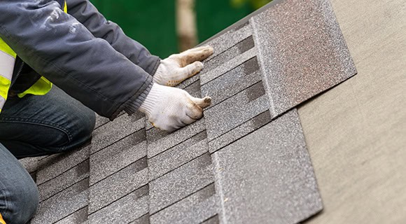 Installation commercial apartment building asphalt shingle roofing