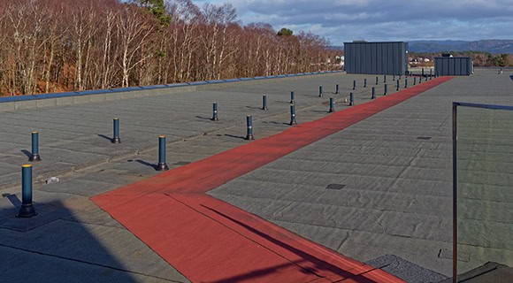Commercial flat roof for high foot traffic reinforced path