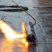 Torch down method used for hot tar roofing Hot tar or hot mop roofing used a torch down method