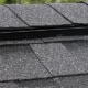 Residential sloped roofing ridge vent